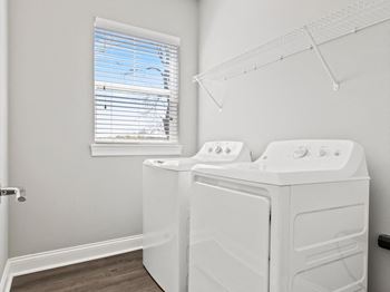 Full size washer and dryer in laundry room